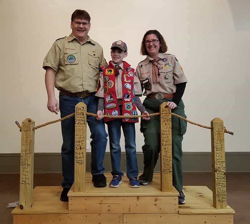 Parent helping a scout with a project